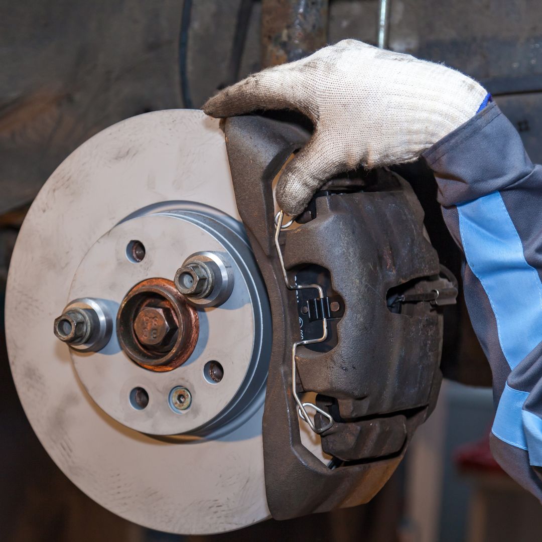 mechanic working on brakes