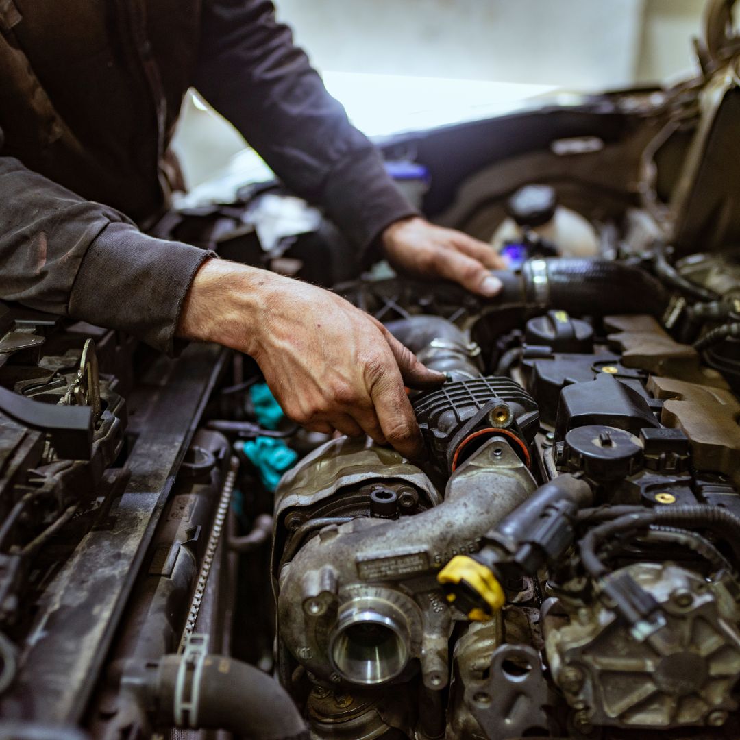 mechanic working on car