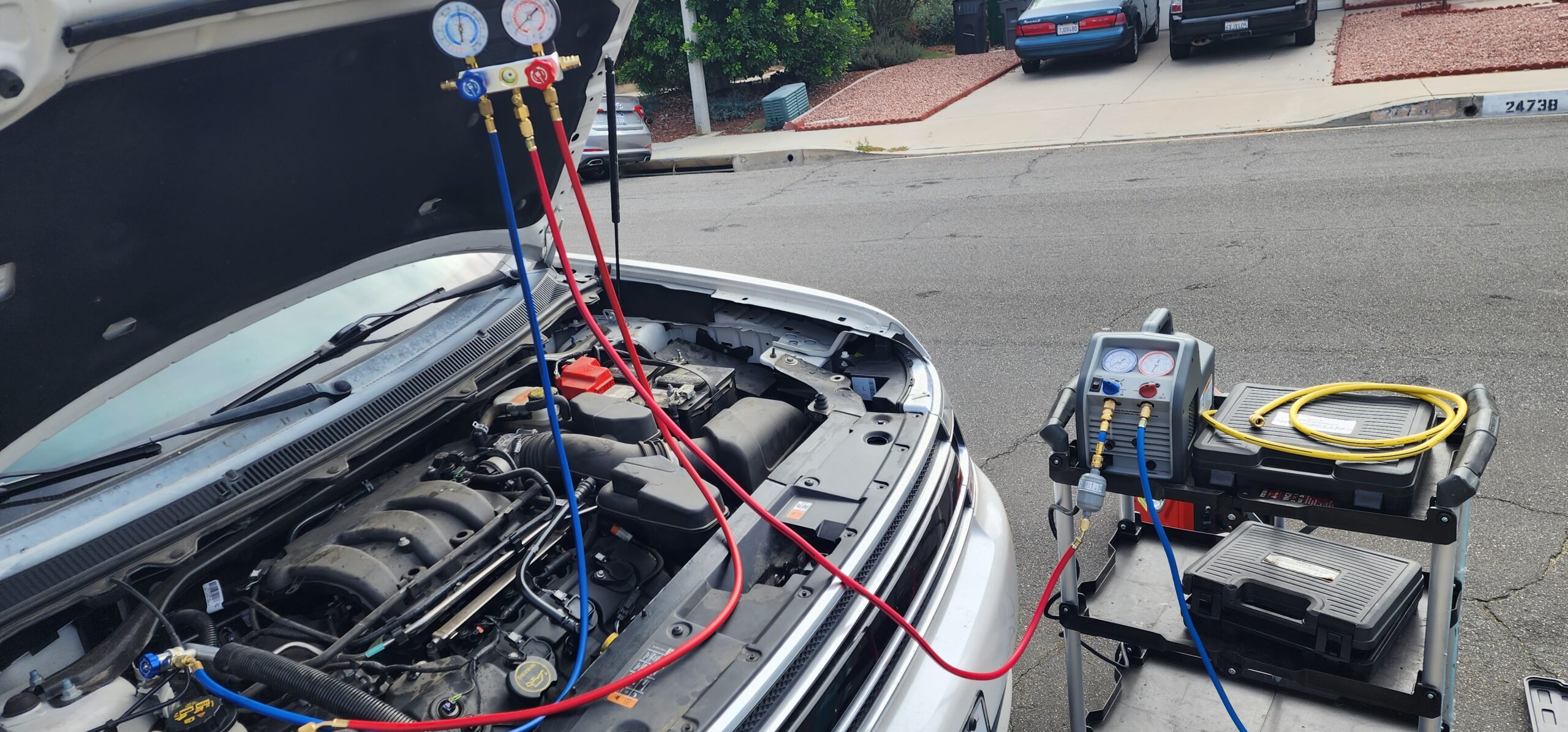 Mobile AC repair technician at work